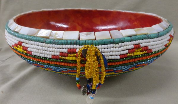 Beaded Console Bowl by Kills Thunder: Beaded Console Bowl by Kills Thunder. Measures 9.5'' opening x 11''D x 3''H, Beautiful craftsmanhip from this noted artist. The bowl is wood and she's colorfully painted the interior. The beadwork spe