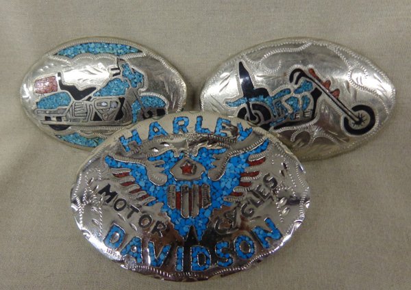 3 Motorcycle Belt Buckles: 3 Motorcycle Belt Buckles, largest measures 3.75''L x 2.5''W and reads ''Harley Davidson Motorcycles'' and is chip coral and turquoise inlay with eagle wings and shield, #2 Two chip coral, onyx, and t