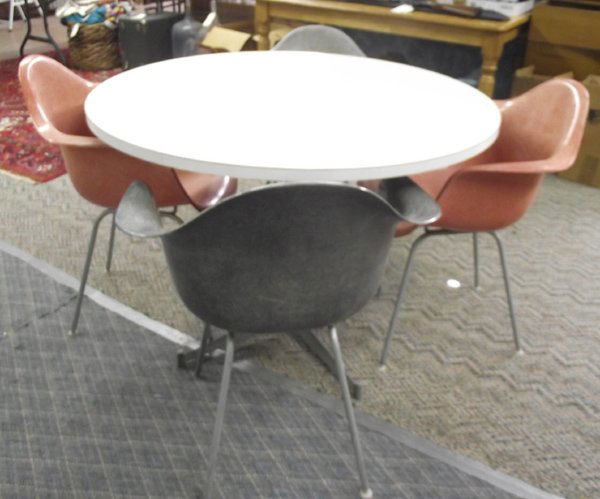 Herman Miller Table & 4 Arm Chairs, Eames Design: Herman Miller Table & 4 Arm Chairs, Eames Design Mid-Century Modern. Herman Miller is the manufacturer of these iconic 1950's Charles & Ray Eames designed pieces. The chairs, molded fiberglass shell a