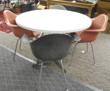 Herman Miller Table & 4 Arm Chairs, Eames Design: Herman Miller Table & 4 Arm Chairs, Eames Design Mid-Century Modern. Herman Miller is the manufacturer of these iconic 1950's Charles & Ray Eames designed pieces. The chairs, molded fiberglass shell a