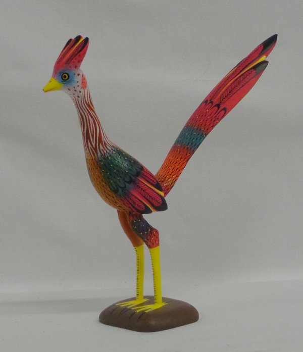 Oaxacan Alebrijes Roadrunner by David L. Bliis: Oaxacan Alebrijes Roadrunner by David L. Bliis. Measures 9'' x 7'', brightly painted in the Oaxacan style. Signed by the artist ''David L. Bliis'' ''Oaxaca Mexico''. Very tip of beak is broken.