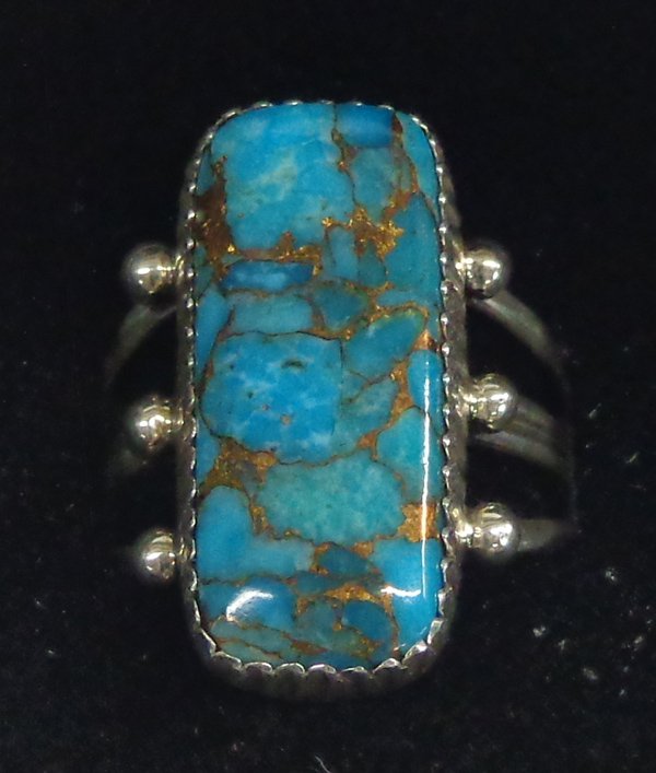 Navajo Sterling & Turquoise Ring by G. Boyd: Navajo Sterling & Turquoise Ring by G. Boyd. This ring has it all! Sterling silver triple shank ring set with high grade Kingman mine turquoise with beautiful copper matrix. Very flattering on the han