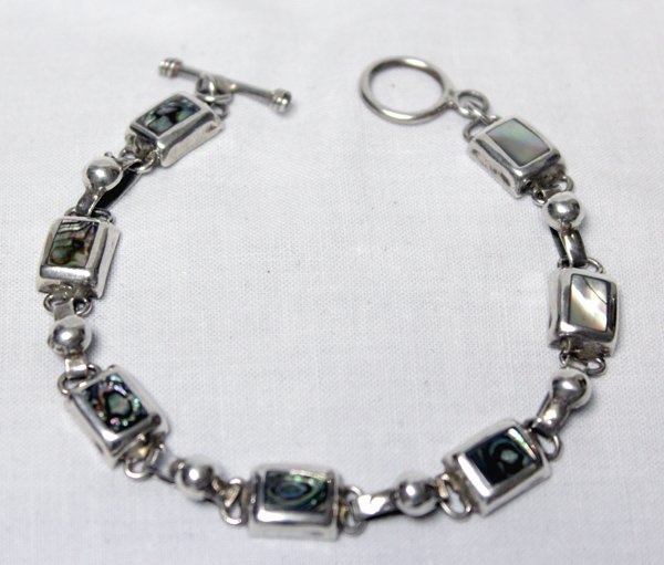 Sterling Silver Abalone Bracelet: Sterling Silver Abalone Bracelet, nice weight, stamped 925 and measures 7'' end to end, toggle closure