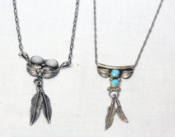 2 Navajo Sterling Silver Necklaces: 2 Navajo Sterling Silver Necklaces, both are sterling silver including the chains, both are hallmarked--one with a symbol of a feather and the other one an R, moonstone necklace's chain is 18'' end to
