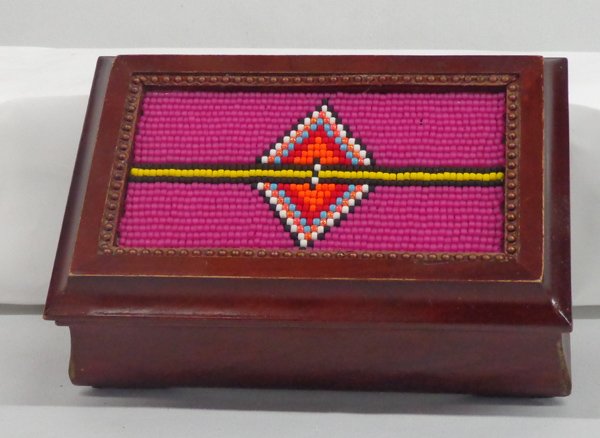 Kills Thunder Beaded Box: Kills Thunder Beaded Box. Noted artist, Kills Thunder, along with her brightly colored paintings, lends her many talents to beading various objects from vases to boxes. The lid of this box, measuring 