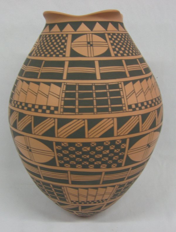 Mata Ortiz Geometric Olla by Mary Cruz Lopez: Mata Ortiz Geometric Olla by Mary Cruz Lopez. Complex geometric design elements provides a dramatic presentation in this large olla. Measures 10.75'' high x 8'' wide. Signed by artist Mary Cruz Lopez.