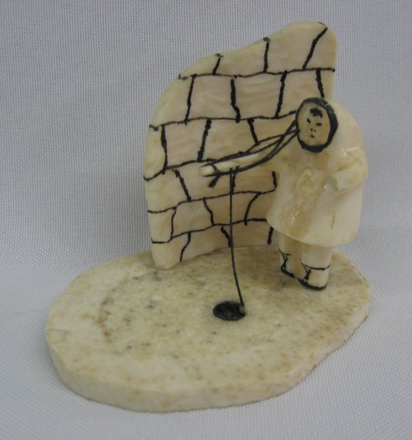 Alaskan Ivory Carving by Dwight Milligrock: Alaskan Ivory Carving by Dwight Milligrood. Small ivory carving of an Alaskan figure ice fishing. Signed by the artist Dwight Milligrock from Diomede, Alaska. Measures 2 1/4'' x 3''. Artist Bio: Dwigh