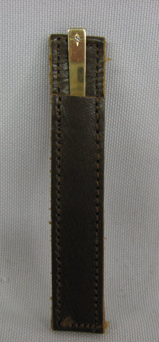 14kt Gold Toothpick With Diamond: 14kt Gold Toothpick With Diamond. The toothpick has a leather case, it is stamped 14kt and measures 2 1/2'' in length.