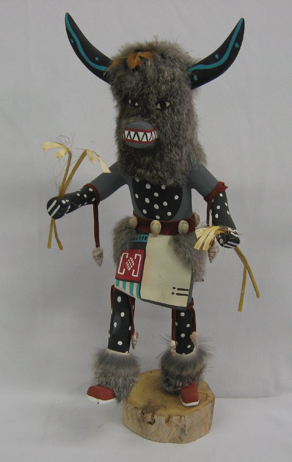 Navajo Ogre Kachina by Ferdinand Belone: Navajo Ogre Kachina by Ferdinand Belone, signed FB and Ogre on the bottom, measures 18''H x 9''W x 7''Deep, beautifully hand carved, painted, and embellished with rabbit fur, feathers, leather, seashe