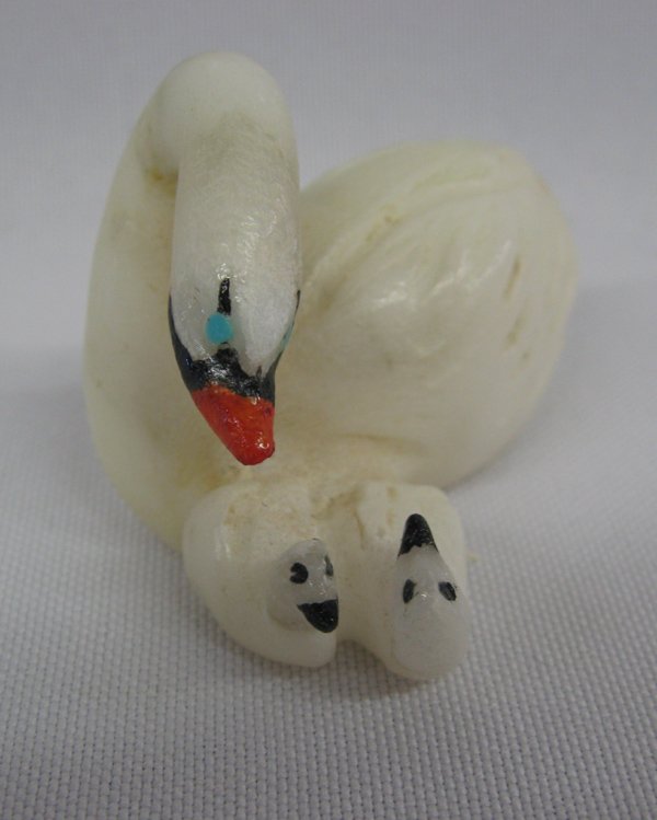 Zuni Carved Alabaster Swan and Cygnets - H Pincion: From the Tucson, Arizona Collection. Zuni Hand Carved Alabaster Swan and Cygnets by Hubert Pincion, measures 2''L x 1 3/8''W x 1 3/8''H, jet-turquoise-red shell accents, neck has been repaired, Artist