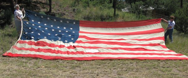 Huge 1890 Wyoming 44 Star Statehood Flag: U.S. Huge 44 Star Flag - Wyoming's Statehood. Wyoming Statehood Flag, 1890. Torn area in the field, has been patched, some small holes as well. This Flag became the Official United States Flag on July