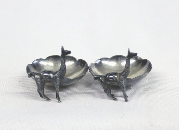Peruvian Sterling Silver Salt Cellars: Peruvian Sterling Silver Salt Cellars, measure 2'' x 1.25'', How sweet these are! Two scalloped salt cellars with llamas standing guard, stamped .925, vintage Peruvian sterling silver, 27.94g in total