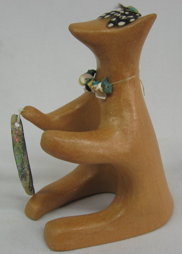 Taos Pueblo Seated Bear Sculpture by Paula Tsoodle: Taos Pueblo Seated Bear Sculpture by Paula Tsoodle. Micaceous clay sculpture of a seated bear, possibly fishing. Piece of carved abalone shell is attached to one paw. A necklace of turquoise and shell