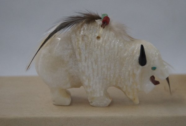 Navajo Hand Carved Marble Buffalo Fetish: Navajo Hand Carved Marble Buffalo Fetish, measures 2.5''H x 3.25''L x 1''W, he has a powerpack made of feathers, a turquoise, coral, and heishi bead, jet horns, soapstone tongue, and turquoise eyes