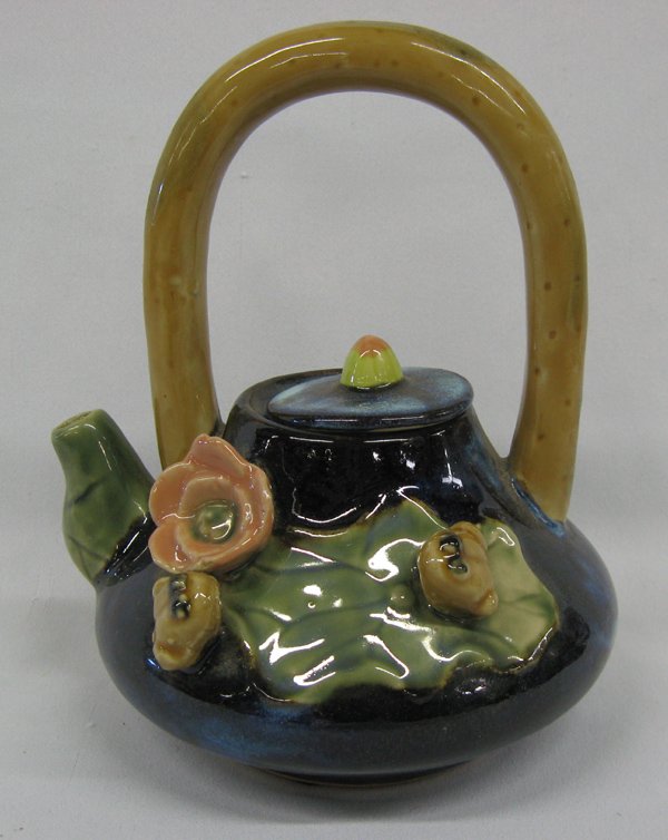 Chinese Ceramic Frogs on Lilypad Teapot: Chinese Frogs on Lilypad Teapot, measures 7.75''H x 6''W x 5''Deep, sweet little teapot with fixed handle, depicts 2 three dimensional frogs on lilypad, one sitting by three dimensional flower