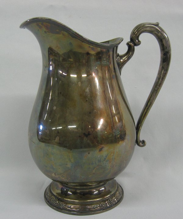International Silver Co. Silver Plated Pitcher: International Silver Company Silver Plate Water Pitcher. This is the pattern Camille # 6017. This pitcher weighs over 2.5 pounds. It is really heavy. It is about 9 inches tall and 5 inches wide. Hallm