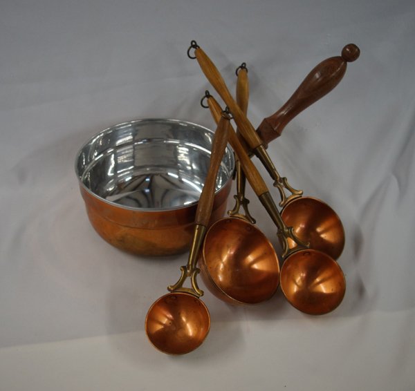 Copper Saucepan and Ladles: Copper Saucepan and Ladles, pan measures 4''H x 8''W x 15'' including handle, longest ladle measures 14''L x 4''W x 2.5''H, the ladles are graduated in size and have wooden handles