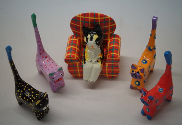 Collection of Painted and Hand Carved Cats: Collection of Painted and Hand Carved Cats. Carved of Albezia wood and hand painted in Bali, we have a Tabby sitting in an armchair (2 pieces) and 4 Kitty ring holders. The holders measure approx. 5.5