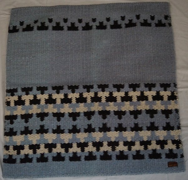 Hand Loom Wool Rug made in India: Hand Loom Wool Rug made in India, measures 33'' x 35'', tag on corner reads ''Hand Loom 90% wool, 10% polyester, dry cleaning recommended, hand woven in India, periwinkle blue, black, and white design