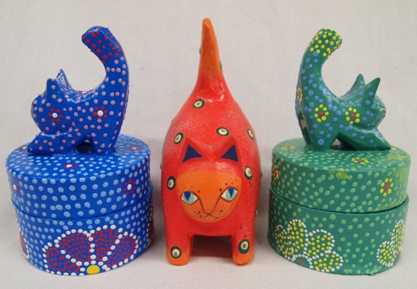 Carved & Painted Cats from Albezia Wood.: Carved & Painted Cats from Albezia Wood. We have 2 Brightly Colored Lidded Boxes and one Fat Cat. The boxes measure approx. 4.5''T x 2.5''W.