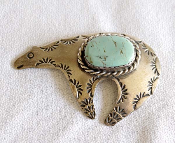 Vintage Navajo Silver Pin by Albert Cleveland: Vintage Navajo Silver Turquoise Bear Pin by Albert & Jeanette Cleveland, hallmarked AJC, sterling silver set with beautiful blue green turquoise cabochon (7/8'' x .5''), hallmarked AJC, measures 2.5''