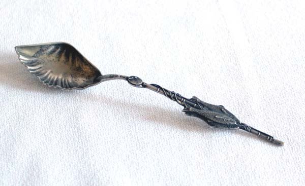 Sterling Silver Fishing Rod Spoon: Sterling Silver Fishing Rod Spoon, measures 5''L x 1''W, charming sterling silver souvenir spoon featuring a cane fishing pole with a string of three fish. The bowl of the spoon is molded to resemble
