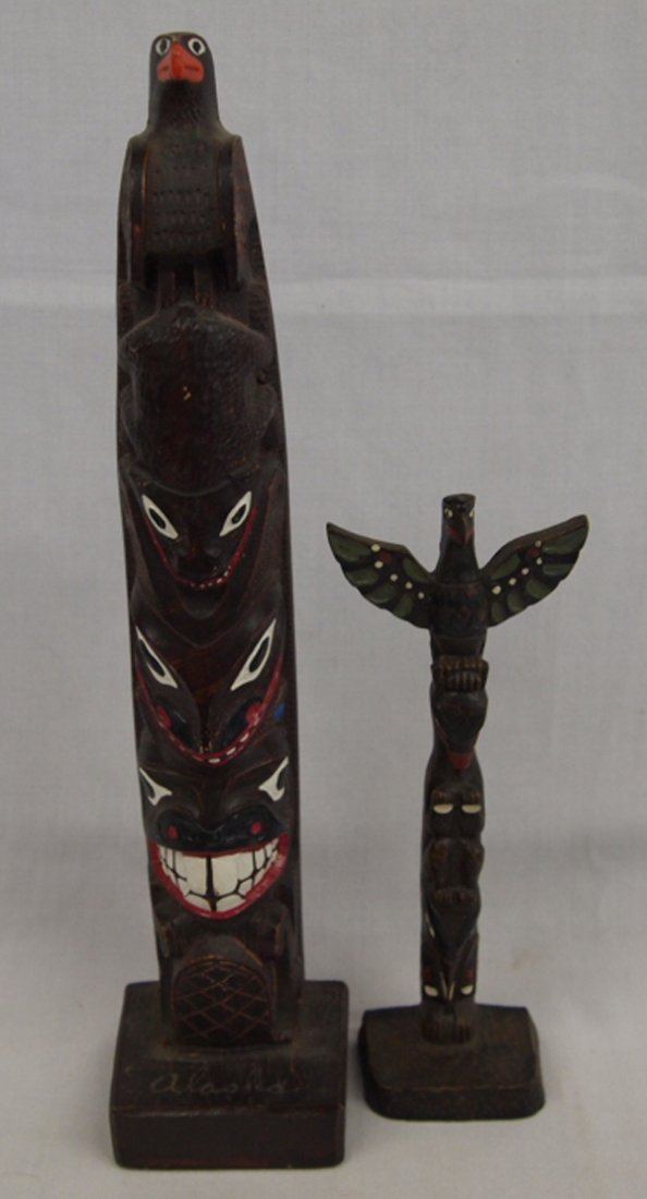 Northwest Coast Trading Post Totem Poles: Northwest Coast Trading Post Wooden Totem Poles, tallest measures 12''H x 2.75''W, both have hand painted details, the largest one is marked Alaska on base