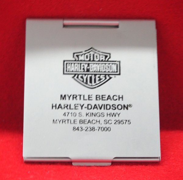 Harley-Davidson Collectible Ladies Compact Mirror: Harley-Davidson Collectible Ladies Compact Mirror, measures 3 1/8''L x 2.75''W closed and 6 1/8''L open, top of compact has Harley Logo and reads ''Myrtle Beach Harley-Davidson 4710 S. Kings Hwy Myrtl