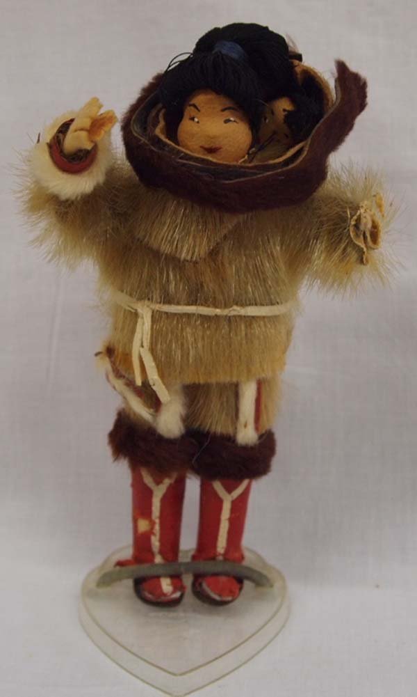 Northwest Coast Mother and Child Doll: Northwest Coast Mother and Child Doll, measures 6.25''T x 3.5''W, missing left hand made of felt, embellished with caribou fur. Child hidden in fur bundle