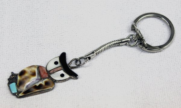 1960's Zuni Owl Keyring by Vera Luna: Zuni Owl Keyring by Vera Luna, hallmarked with etched initials VL on back, owl measures 1.75''L x 5/8''W, channel and stone to stone inlay includes: turquoise, onyx, shell and coral