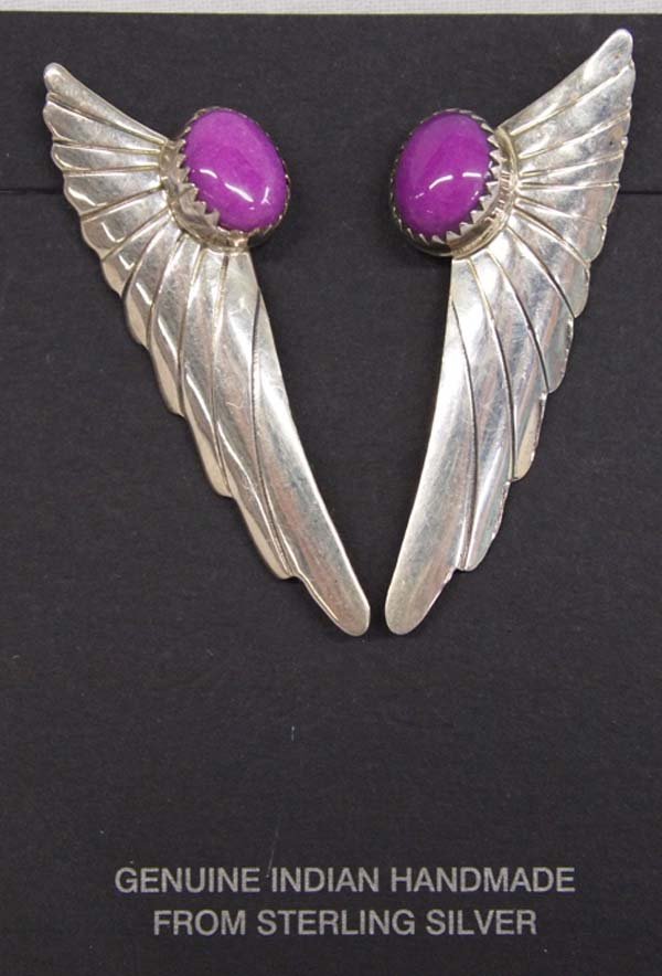 Navajo Sterling Sugilite Earrings by Jean Dixon: Navajo Sterling Sugilite Earrings by Jean Dixon, measure 2''L x .5''W, features carved silver wing designs with 3/8''D sugilite cabochons, hallmarked J, 5.93g in total wt.