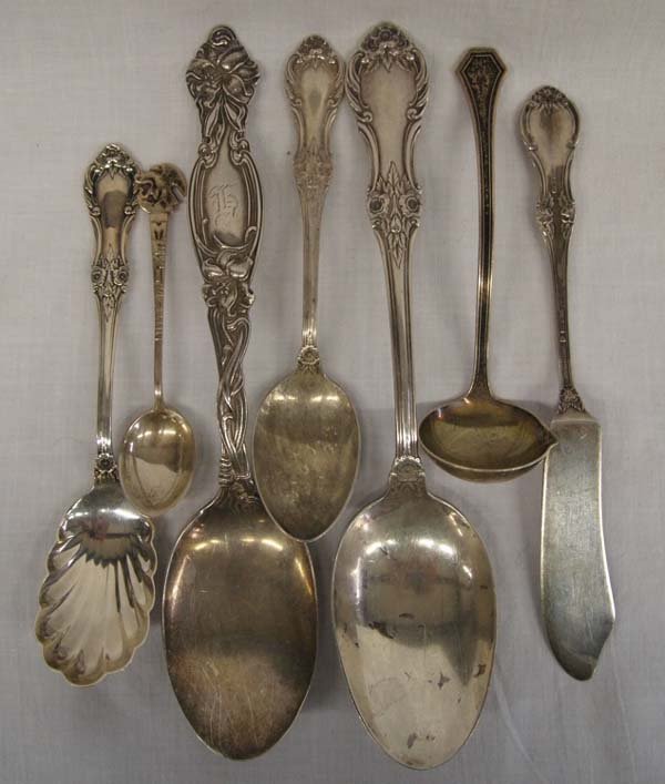 Lot of Sterling Silver Flatware-7 Pieces: Lot of Sterling Silver Flatware-7 Pieces. Lot includes International ''Wild Rose'', serving spoon, teaspoon, sugar shell and master butter knife. Serving spoon, ''Tiger Lily'', monogrammed. Small crea