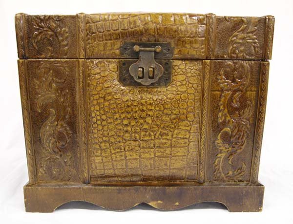 Small Handled & Embossed Leather Covered Chest: Small Handled & Embossed Leather Covered Chest. This treasure, with it's leaf design and ornate handles, is lined in velvet and measures approx. 10''H x 12''W x 8.5''D.