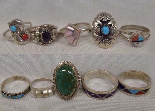 Collection of 10 Zuni and Navajo Sterling Rings: Collection of 10 Zuni and Navajo Sterling Rings, sizes range from 12 down to 5, stones featured are sugilite, onyx, pink coral, pink mother of pearl, turquoise, and coral, largest measures 1''L x .75'