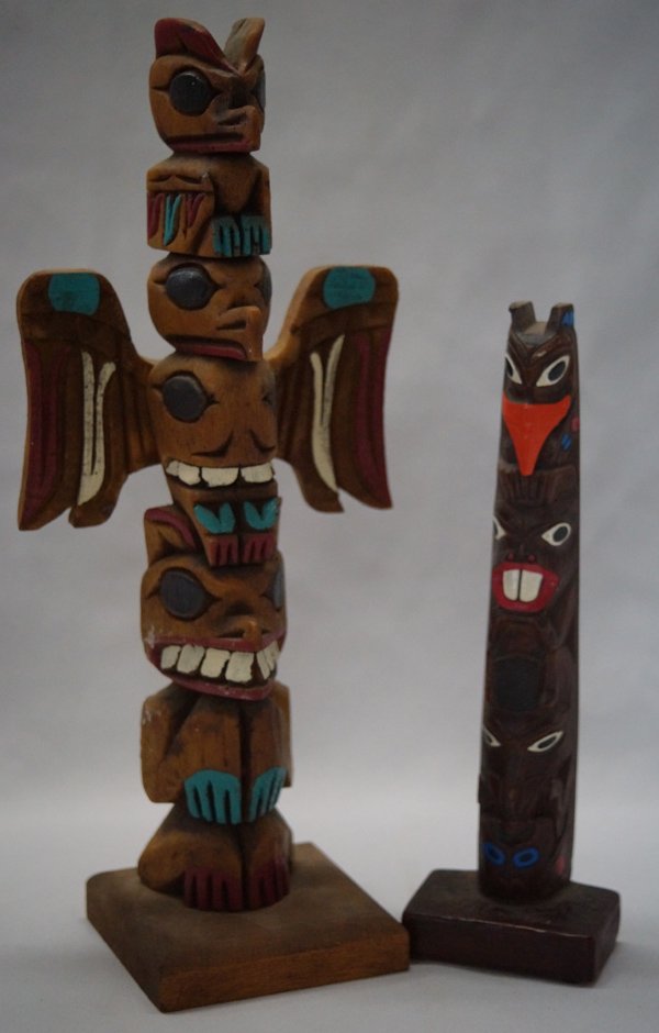 2 Alaskan Trading Post Wooden Totem Poles: 2 Alaskan Trading Post Wooden Totem Poles. 13'' high X 5'' wide. The different animal figures such as thunderbird, beaver, bear, and whale are on the poles to depict a story. The totems are regarded b