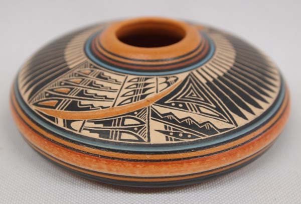 Navajo Pottery by Lawrence M Crank: Navajo Pottery by Lawrence M Crank. An intricate design adorns this piece which measures approx. 1.5'' x 3.5''
