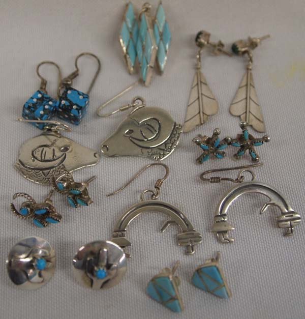 Nine Pairs Navajo Earrings Plus Sterling Pendant: Nine Pairs Navajo Earrings Plus Sterling Pendant. Stamped sterling silver and turquoise channel inlays as well as needlepoint and small cabochons. Pendant matches earrings, carved channel set turquois