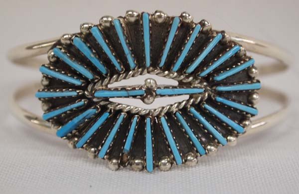 Zuni Silver Turquoise Petit Point Bracelet by J. Vacit: Zuni Silver & Turquoise Petit Point Bracelet by Joyce Vacit Tsethlikai, signed by ''JV''. Slim petit point rays are supported by a double shank. Bracelet measures 6 1/4'', including opening and is 1''