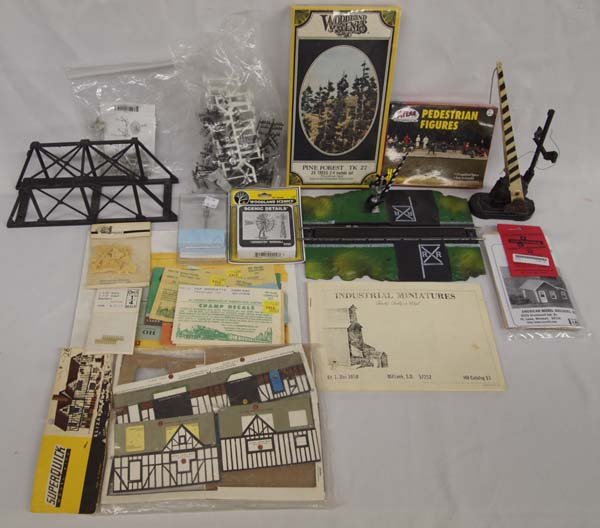 Model Railroad Scenic Details Lot: Model Railroad Scenic Details Lot. Lot contains train trestle, pedestrian figures, many decals, pine forest kit, gate crossing, signs, figures and more!