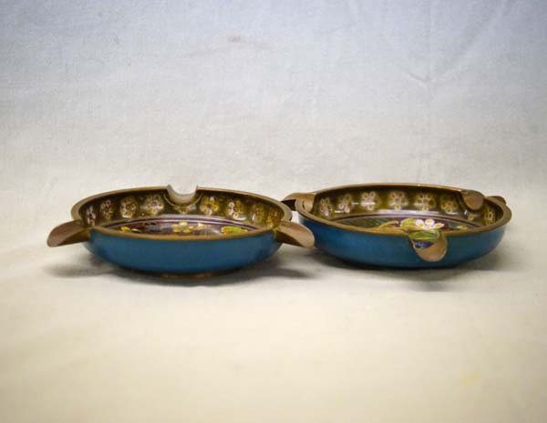 Two Vintage Chinese Cloissonne Ashtrays: Two Vintage Chinese Cloissonne Ashtrays. Copper ashtrays with enamel and cloisonne floral interiors.