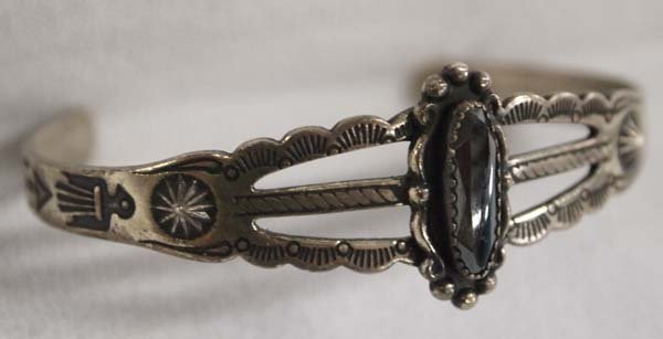 1950 Navajo Sterling Route 66 Hematite Bracelet: 1950 Navajo Sterling Route 66 Hematite Bracelet, inside measures 6.25'' which includes opening x .75''W, band is beautifully stamped with thunderbirds and arrows, 11g in total wt.