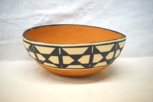 Santo Domingo Chile Bowl by Anna M.T. Lovato: Santo Domingo Chile Bowl by Anna M.T. Lovato, hallmarked on bottom AMTL, measures 8''D x 3''H, comes with traditional black and cream designs on terra cotta, spirit path line on rim