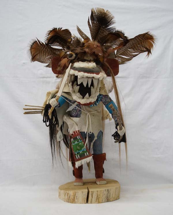 1960 Hopi Hunting Ogre Kachina: Phenomenal 1960 Hopi Hunting Ogre Kachina, measures 20'' x 13'', embellished with feathers, wool, horsehair, yarn, wood bow, doeskin quiver and arrows, conchos on hightop leather moccasins, he is wear