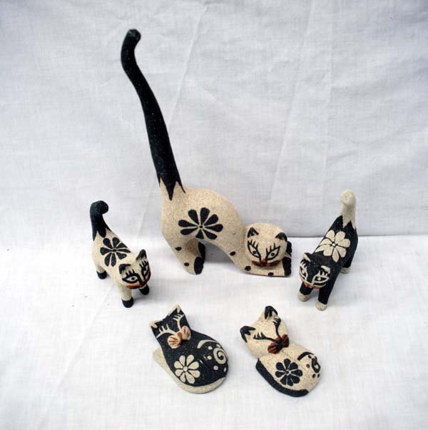 Balinese Hand Carved Albezia Wood Kitty Cats: Litter of Balinese Hand Carved Albezia Wood Kitty Cats, these cuties range in size from 3'' to 11'', they have been coated with natural black and gray sand from the beaches of Bali