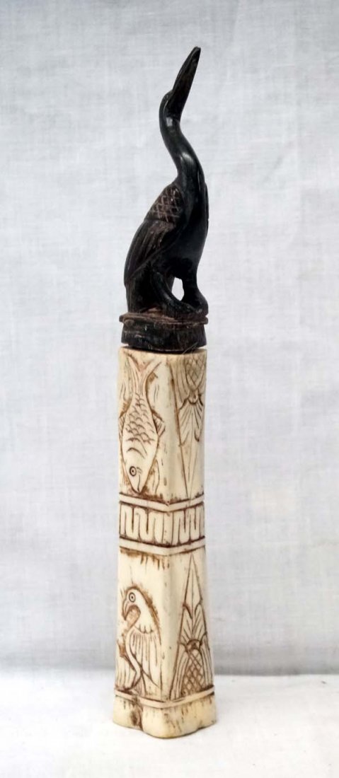 Lombok Island Carved Buffalo Horn Herb Box: From Lombok island, Indonesia - called an "Herb box" but used by them for storing lime powder, which is used when chewing betel nuts. Carved Buffalo Horn Obelisk Box with Carved Buffalo Horn Heron Lid
