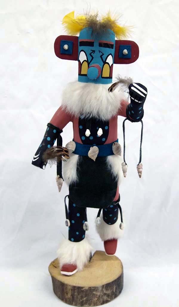 Navajo Morning Singer Kachina by Ferdinand Belone: Navajo Morning Singer Kachina by Ferdinand Belone, measures 16''H x 7''W, hallmarked on bottom by artist FB, embellished with shells, leather ties, feathers, and rabbit fur