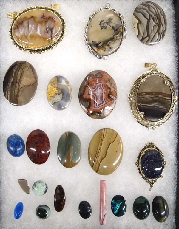 Collection of Polished Cabochons: Collection of Polished Cabochons, largest measures 1.5'', includes jasper, golden onyx, lapis, blue sunstone, malachite, dendritic agate, glass, druzy, charcocite, and rhodochrosite