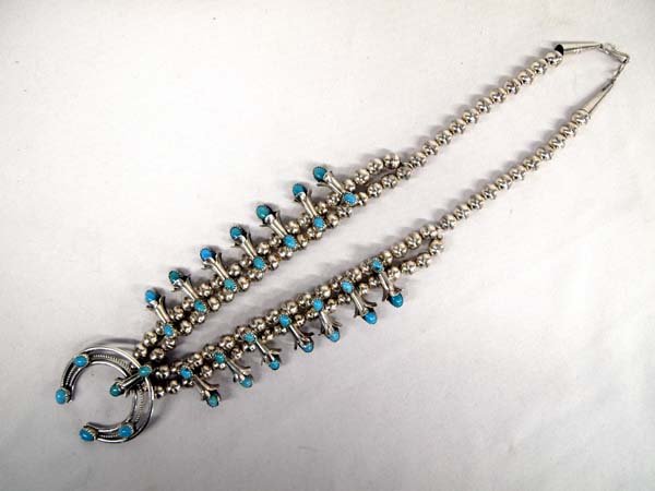 Navajo Silver Turquoise Squash Blossom Necklace: Fabulous Navajo Sterling Silver Bisbee Blue Turquoise Squash Blossom Necklace by Phil Garcia, measures 14'' end to end, blossoms measure 1''L, naja measures 1.5'' x 2'', stamped sterling and hallmarke