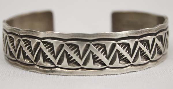 Navajo Old Pawn Silver Cuff Bracelet - D. Etsitty: Native American Navajo Old Pawn Sterling Silver Cuff Bracelet - Douglas Etsitty, hallmarked and stamped sterling, inside measures 6.5'' which includes opening x .5''W, lovely carved details, 25.03g in