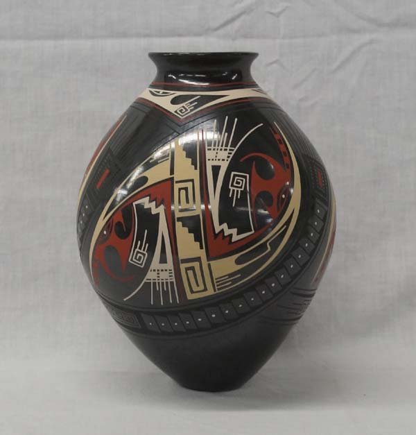 Mata Ortiz Polychrome Jar by Cesar Bugarini: Mata Ortiz Polychrome Geometric Jar by Cesar Bugarini, signed on bottom by artist, measures 9.5''H x 7''D, highly burnished gun metal finish